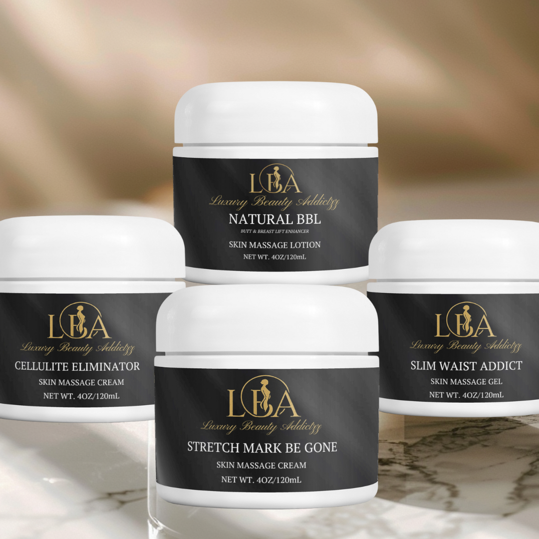 Set of four skincare jars with black labels on a marble surface