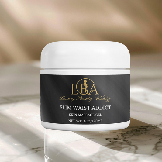 Jar of 'Slim Waist Addict' skin massage gel on a marble surface with a blurred background