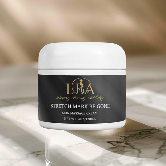 Jar of Stretch Mark Be Gone cream on a marble surface with a blurred background